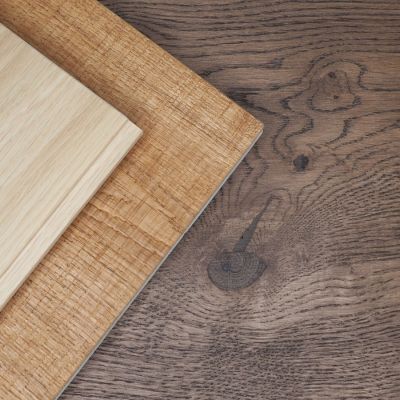 Light and dark oak plank floors featuring varied, natural grain patterns that give each floor a unique character.